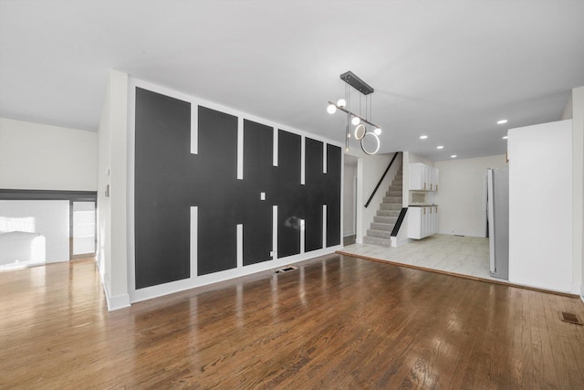 unfurnished living room featuring light hardwood / wood-style floors