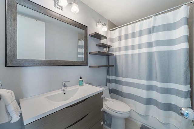 full bathroom with vanity, toilet, and shower / bath combo with shower curtain