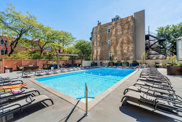 view of pool with a pergola and a patio area