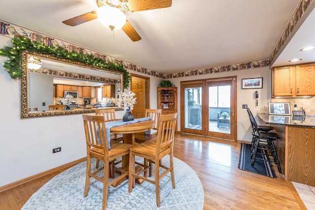 dining room featuring ceiling fan and light wood-type flooring