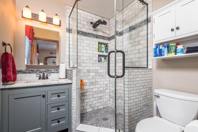 bathroom featuring tasteful backsplash, vanity, toilet, and an enclosed shower