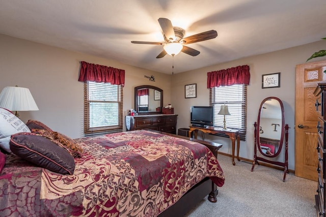 carpeted bedroom with ceiling fan