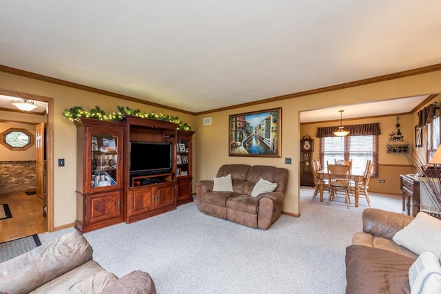 living room featuring ornamental molding and light carpet