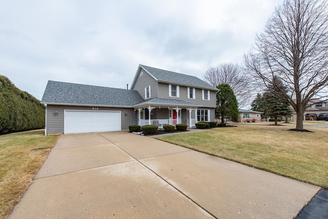 view of front facade with a porch, a garage, and a front yard