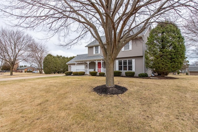 view of front of home featuring a garage and a front lawn