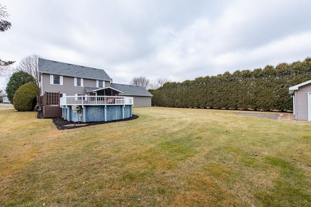 view of yard with a swimming pool side deck