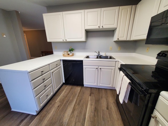 kitchen featuring black appliances, white cabinetry, sink, kitchen peninsula, and dark wood-type flooring