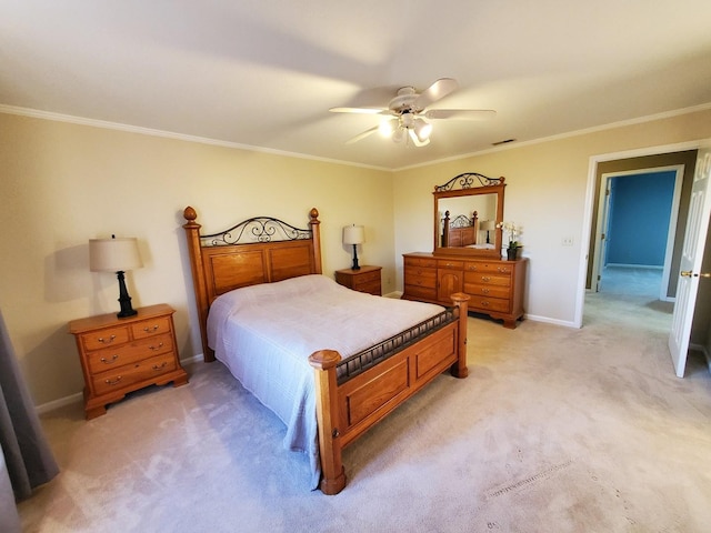 carpeted bedroom featuring ceiling fan and ornamental molding