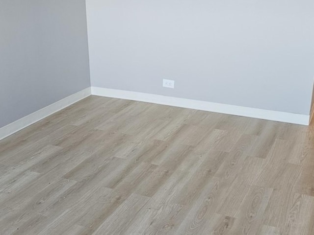 unfurnished room featuring light hardwood / wood-style flooring