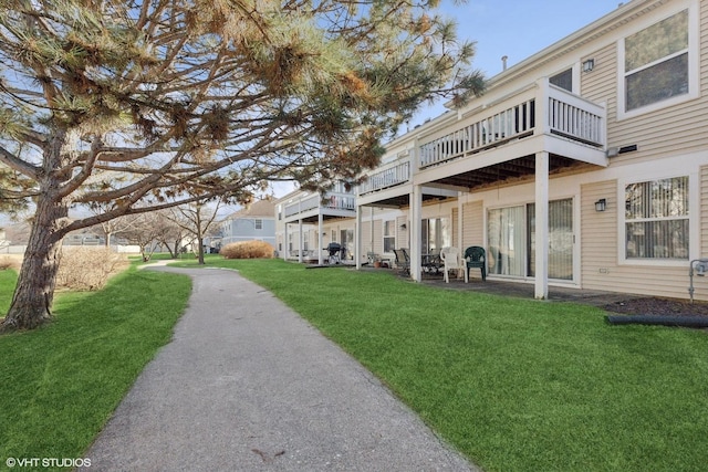 view of property's community with a yard