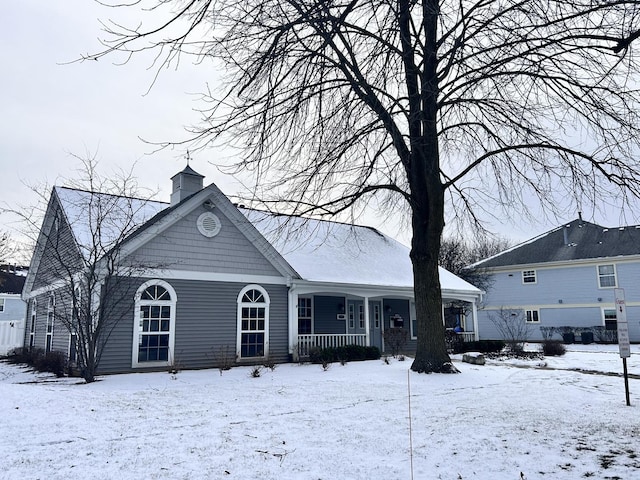 view of snow covered house