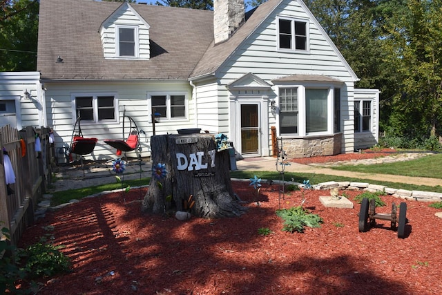 view of new england style home