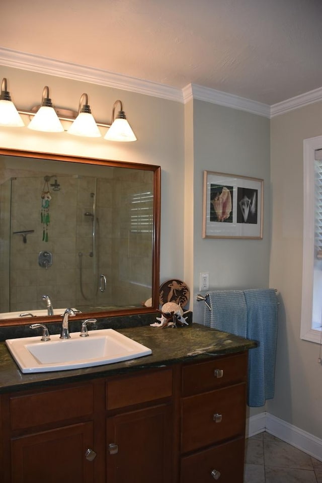 bathroom with crown molding, an enclosed shower, tile patterned floors, and vanity