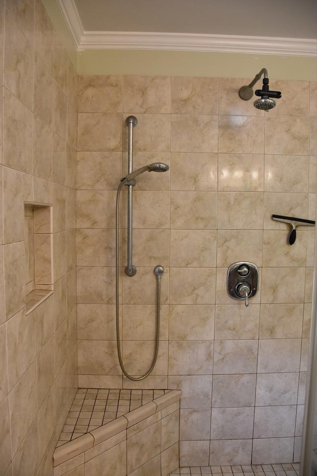 bathroom featuring a tile shower and ornamental molding