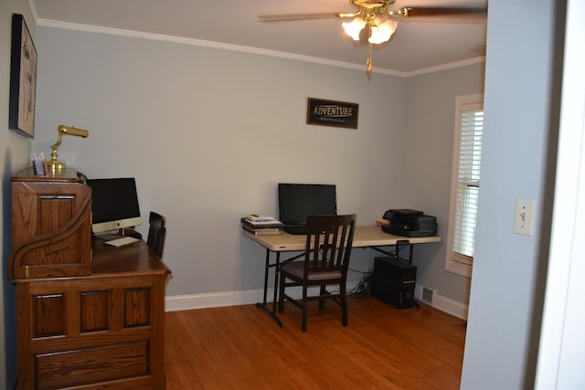 office space featuring crown molding, ceiling fan, and hardwood / wood-style flooring