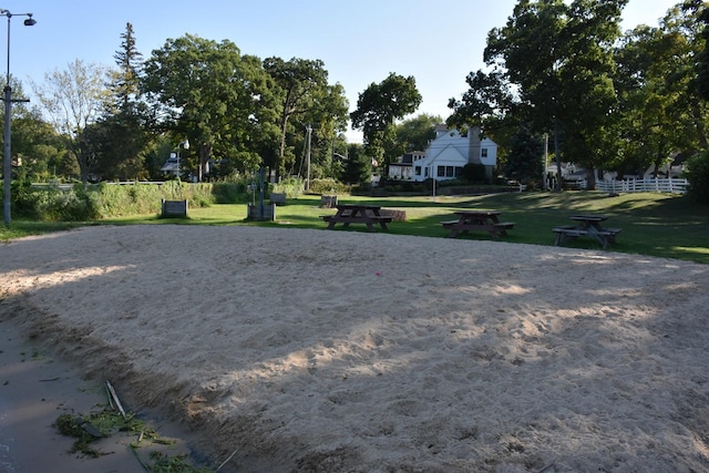 view of community featuring a yard and volleyball court