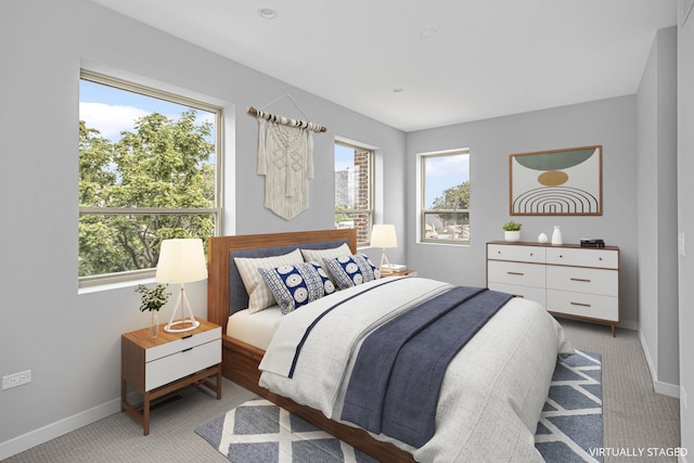 bedroom featuring light carpet