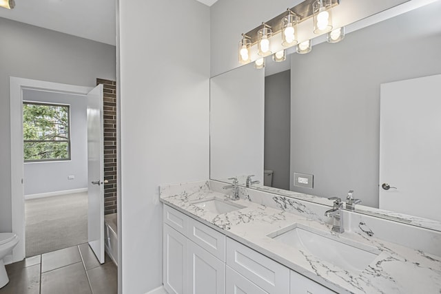 full bathroom with tile patterned flooring, vanity,  shower combination, and toilet