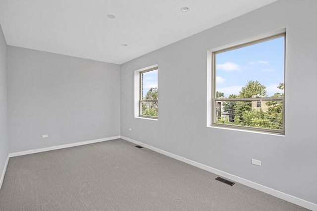 unfurnished room with carpet floors