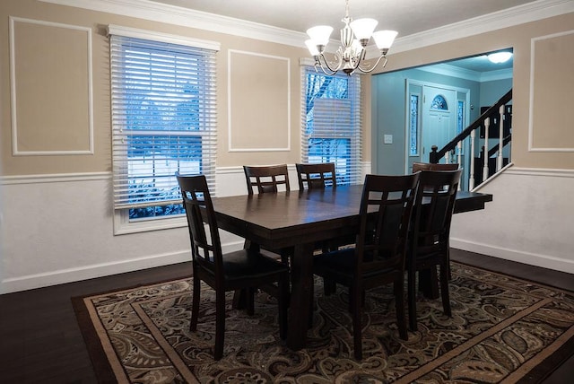 dining area with crown molding, dark hardwood / wood-style floors, and a notable chandelier