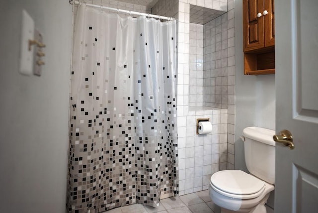 bathroom with tile patterned flooring, curtained shower, and toilet