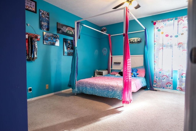 bedroom with ceiling fan and carpet floors