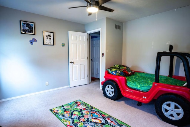 bedroom featuring light carpet and ceiling fan