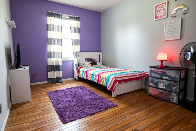 bedroom featuring wood-type flooring