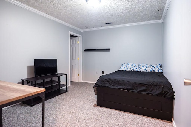 bedroom with ornamental molding, carpet, and a textured ceiling