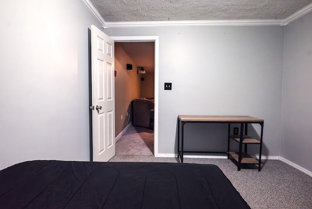 carpeted bedroom with ornamental molding and a textured ceiling