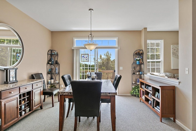 view of carpeted dining space