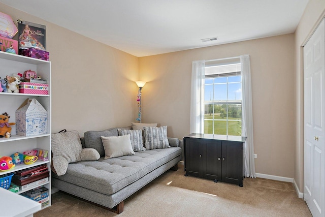 living area featuring carpet