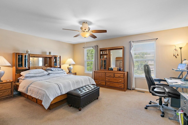 carpeted bedroom with ceiling fan