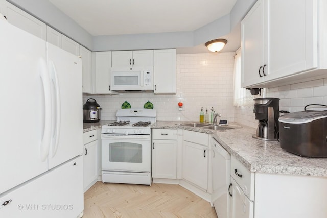 kitchen with white cabinetry, sink, white appliances, and decorative backsplash