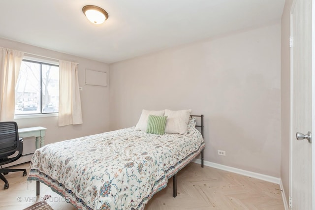 bedroom featuring light parquet flooring