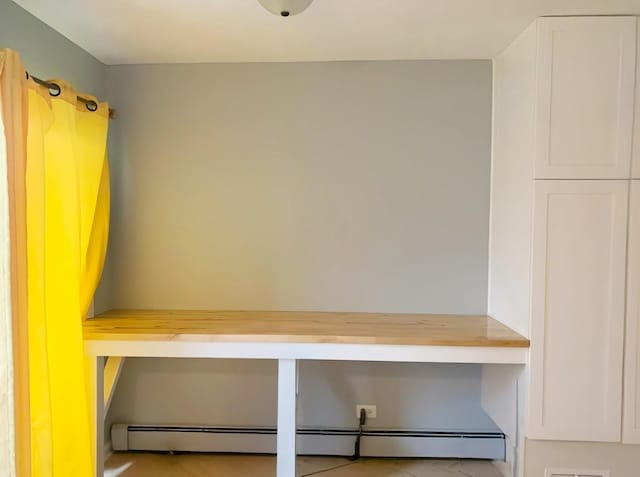 mudroom featuring baseboard heating