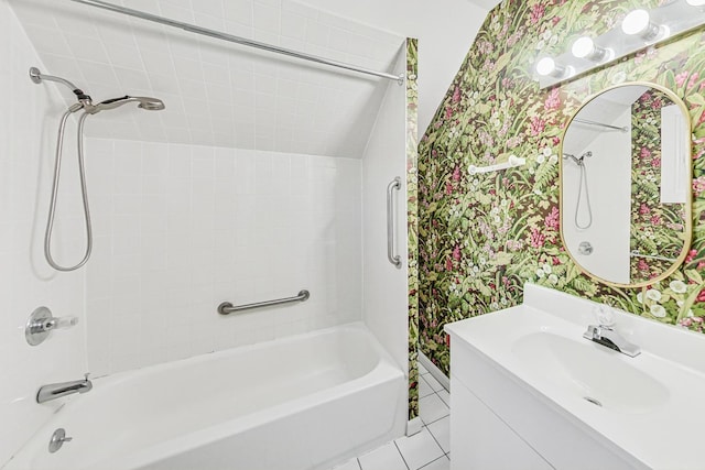 bathroom featuring vanity, tiled shower / bath combo, and tile patterned flooring