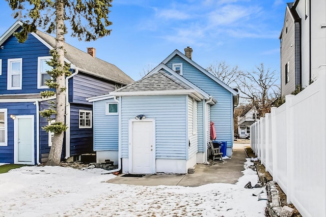 view of snow covered house