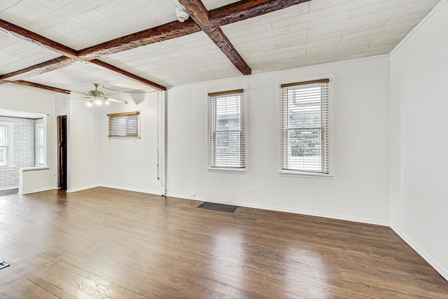 empty room with ceiling fan, coffered ceiling, dark wood-type flooring, and beam ceiling