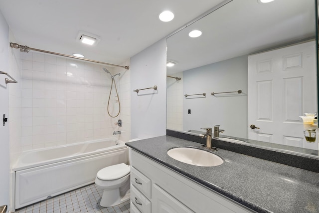 full bathroom with vanity, tile patterned floors, toilet, and tiled shower / bath