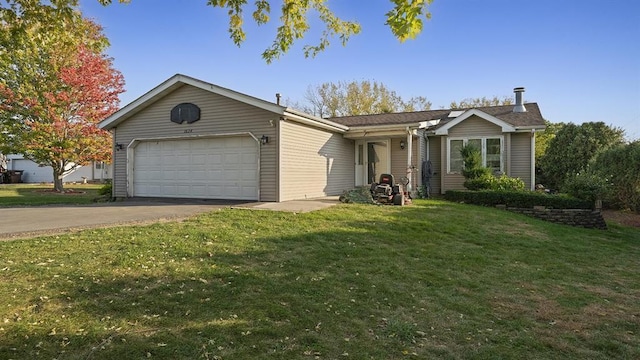 ranch-style home with a garage and a front yard