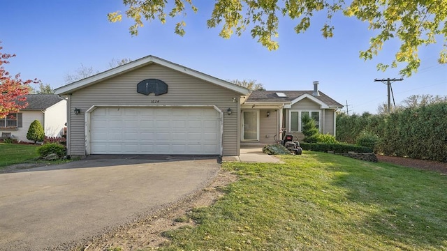 ranch-style home featuring a garage and a front yard