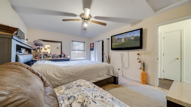 bedroom with ceiling fan and light colored carpet