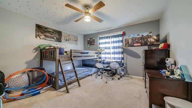 bedroom featuring light carpet and ceiling fan