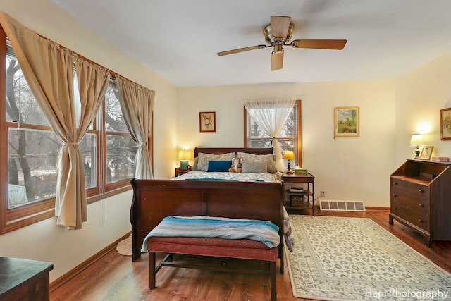 bedroom with ceiling fan and hardwood / wood-style floors