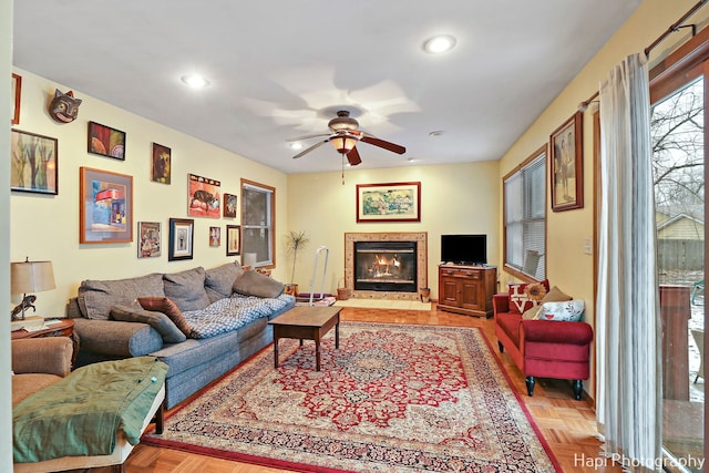 living room with ceiling fan and light parquet floors