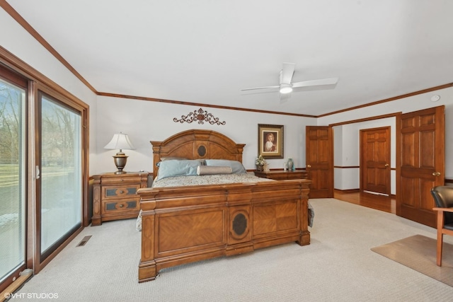 carpeted bedroom featuring crown molding, access to outside, and ceiling fan