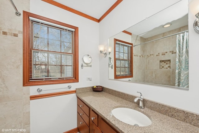 bathroom with vanity, curtained shower, and crown molding