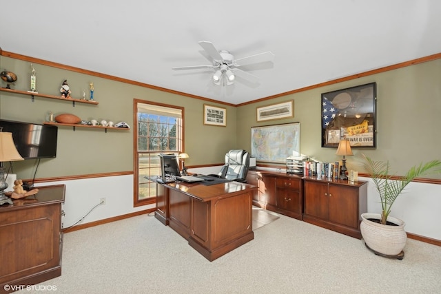 home office with ornamental molding, light colored carpet, and ceiling fan