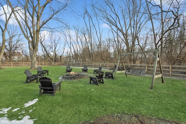 view of yard with a fire pit